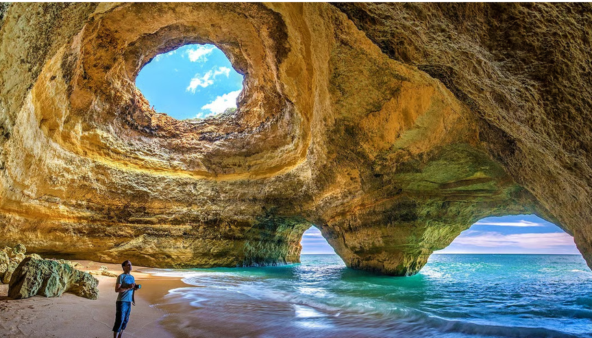 A sunlit sea cave on Portugal's Atlantic coast